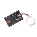 Keychain with a printed card featuring people and vehicles on a white background